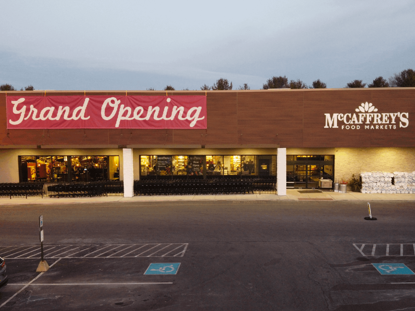 a newly built food market with a grand opening sign.